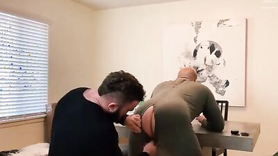 Horny boss bends over his worker and fucks him in the office